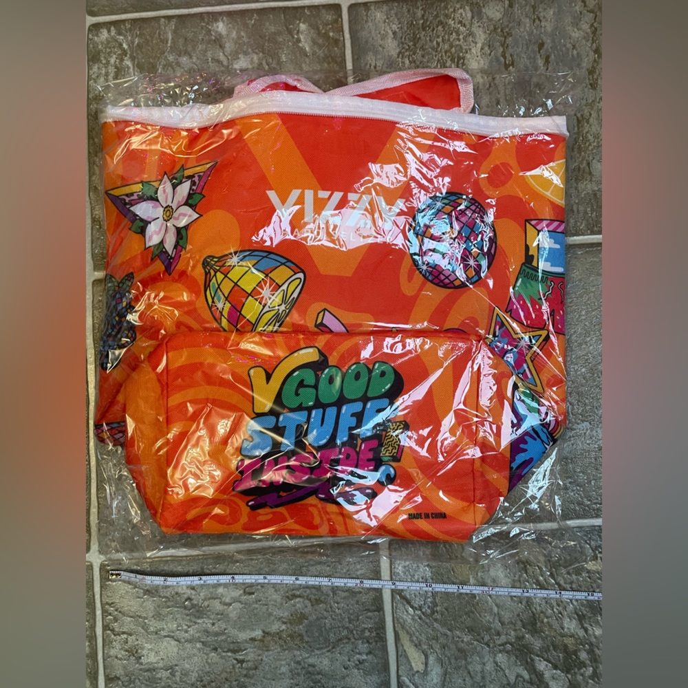 NWT, unopened VIZZY reusable orange/white bag with straps and zipper